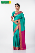 Model wearing Shreeshta teal saree with magenta border