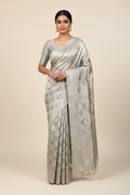 Model wearing silver grey diamond brocade saree