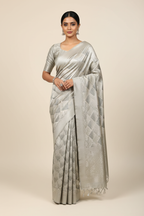 Model wearing silver grey diamond brocade saree