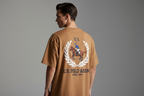 Model wearing U.S. Polo Assn. camel t-shirt - back