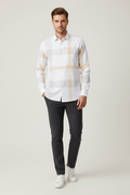 Model wearing white grey check plaid shirt