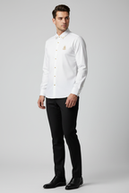 Model wearing white royal crest shirt