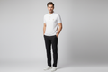 Model wearing white textured grid polo shirt