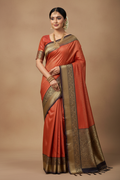 South Indian Model in Brick Red Silk Saree with Black Gold Zari Temple Border