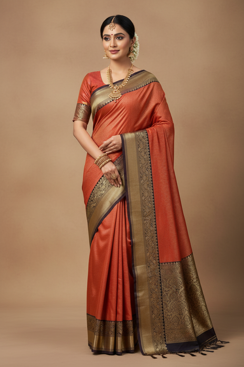 South Indian Model in Brick Red Silk Saree with Black Gold Zari Temple Border