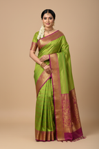 South Indian Model in Parrot Green Silk Saree with Wine Zari Border