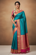 South Indian Model in Teal Silk Saree with Hot Pink Gold Zari Border