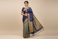 Woman wearing blue grey Kanchipuram silk saree