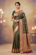 Woman wearing dark green Banarasi saree